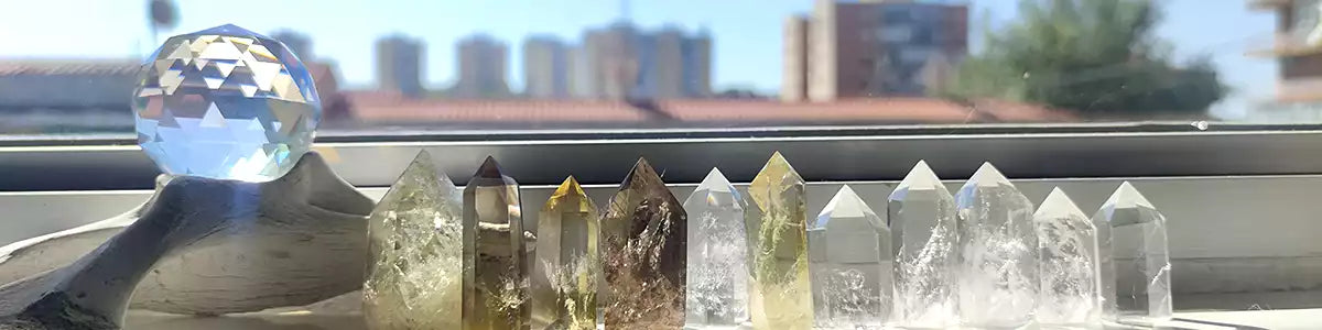 citrine, smoky quartz and clear quartz towers near a sunny window