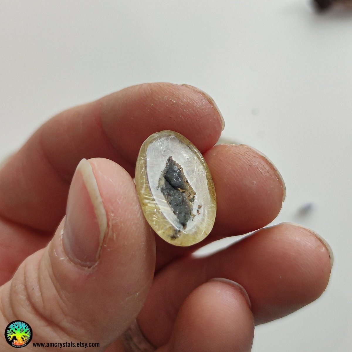 Gold Rutilated Quartz Cabochon with Hematite - Anima Mundi Crystals